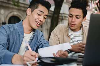 two guys looking at paperwork
