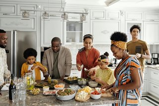 black family serving dinner