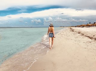 woman walking on beach