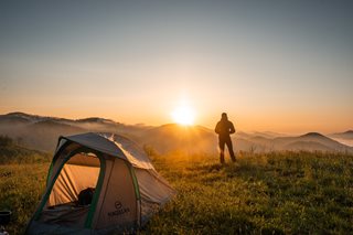 man camping with tent