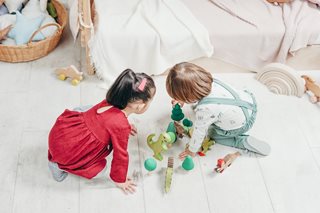 two kids playing with toys