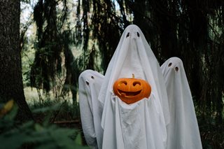 ghosts holding a pumpkin