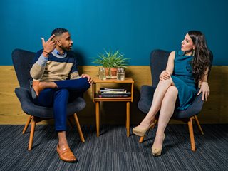 man and woman talking