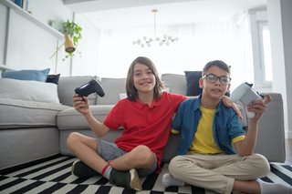 two boys playing video games