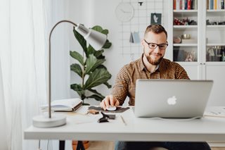 man looking at laptop