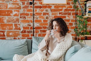 woman sitting on couch