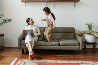 young girl and mother on couch