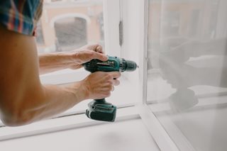man using a drill