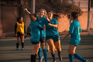 soccer team hugging