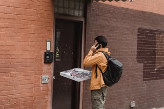 man delivering a pizza