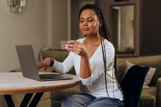 woman looking at a debit card