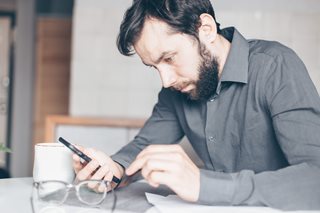 sad man holding a pen