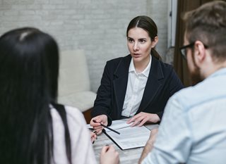 woman talking to couple