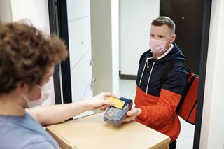 pizza delivery man taking payment