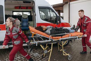 paramedics and person in stretcher