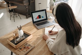 woman looking at a graph