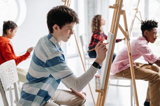 teenage boy painting
