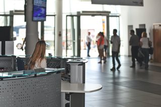 woman at reception desk in building