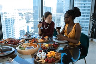 two women eating a fancy meal