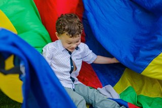small kids playing in a slide