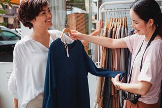 two women shopping for a top