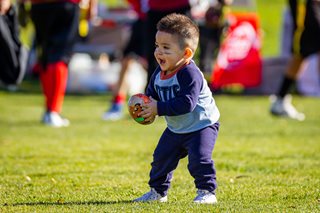 toddler playing with a ball