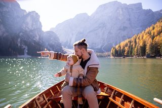 man with baby on the boat