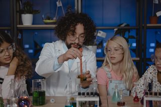 scientist man teaching young children