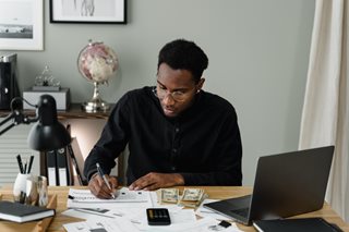 black man working on a budget
