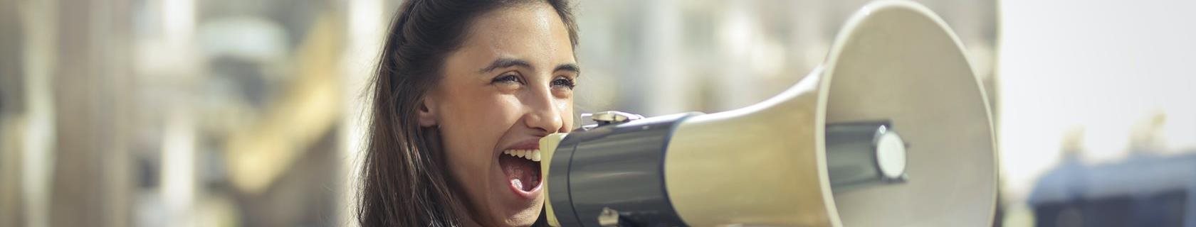 woman talking into a megaphone